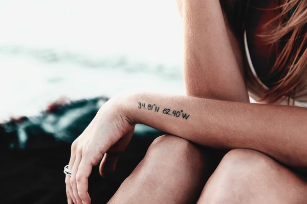 The girl with the C R E A T E tattoo
